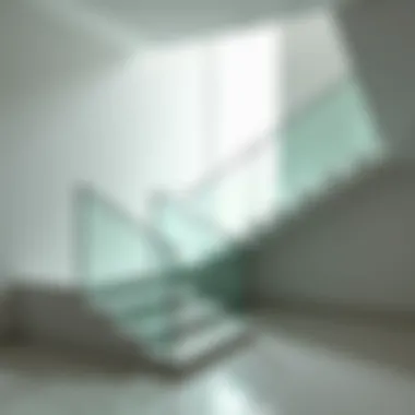 A minimalist staircase featuring glass railings